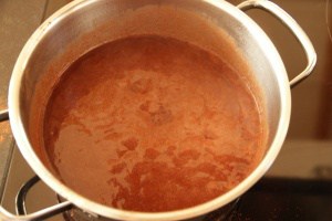 Chocolate mixture boiling in pot