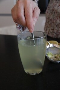 Stirring lemon honey drink