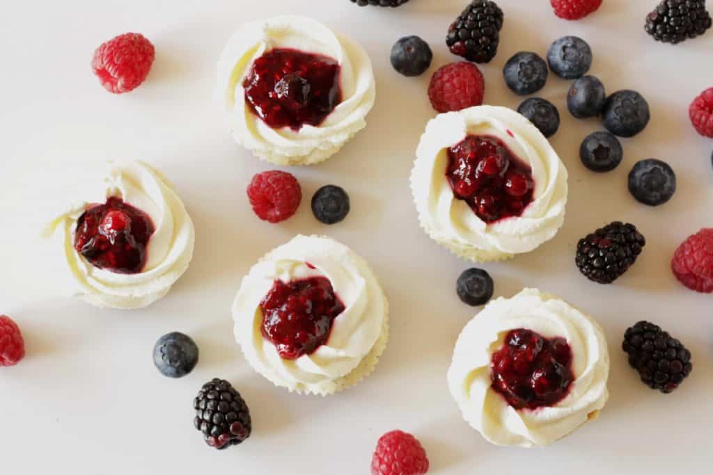 Cheesecake Cupcakes with Berries & Cream ~ Living on Cookies