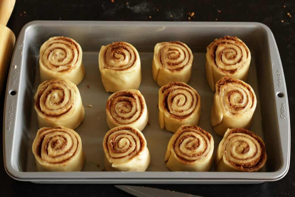 12 raw cinnamon rolls in rectangular pan