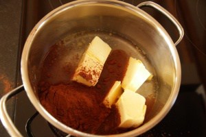 Cocoa, butter, water in pot