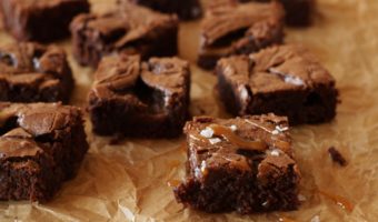 Salted Caramel Brownies on brown parchment paper