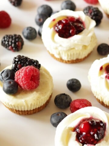 Cheesecake Cupcakes with Berries & Cream ~ Living on Cookies